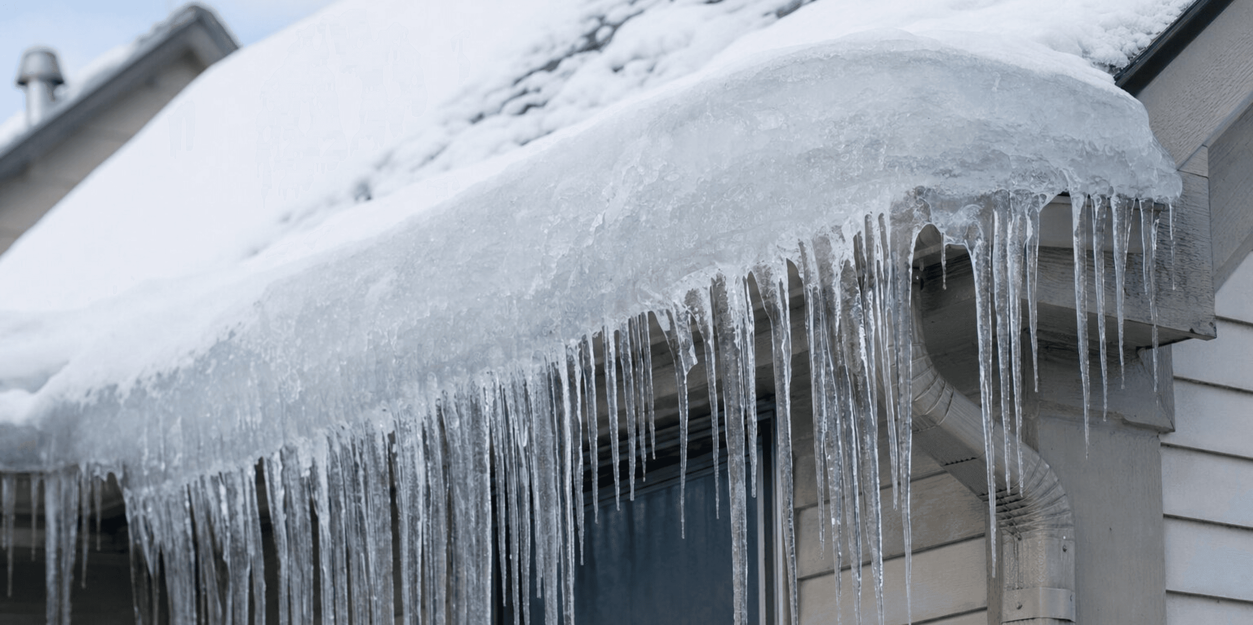 Ice dam damage on a residential roof in Green Bay Wisconsin