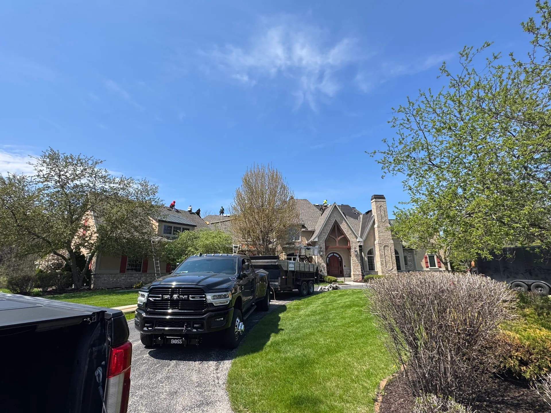 Pierce Roofing truck and trailer on site for a roof replacement in Green Bay WI
