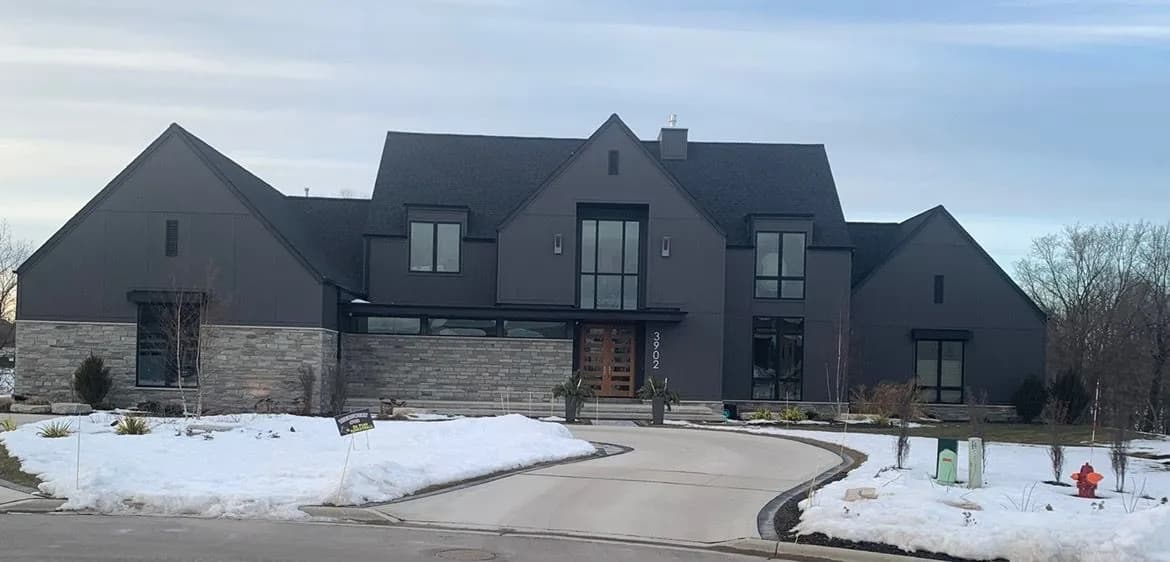 Modern dark grey Green Bay home with skylights bringing natural daylight into the interior