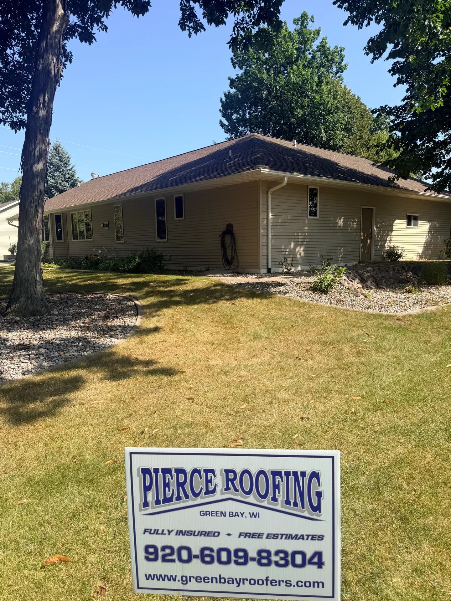 Ranch home with a finished roof replacement by Pierce Roofing in De Pere WI